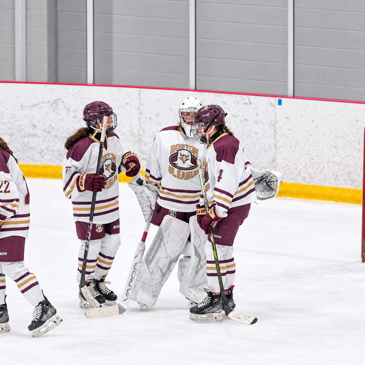 Grace Gordon with teammates on the ice